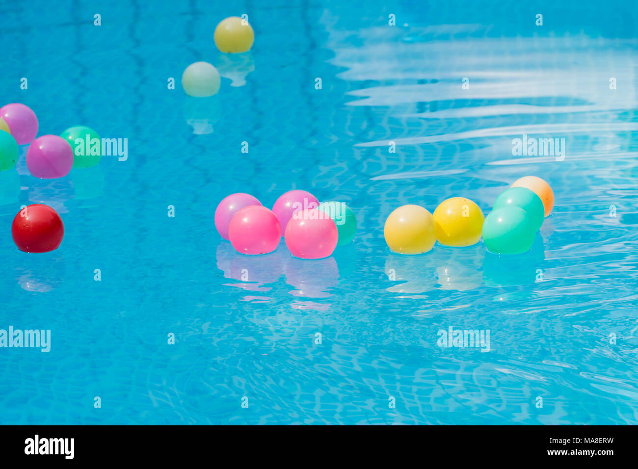 Colorful plastic balls in swimming pool Stock Photo - Alamy