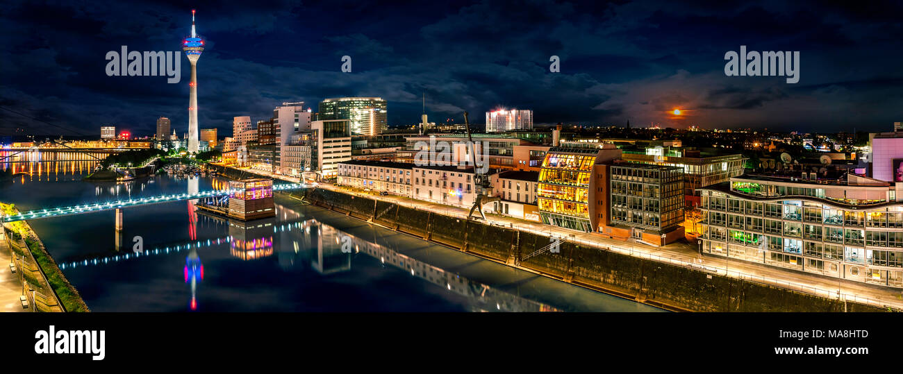 Duesseldorf Medienhafen bei Nacht mit Rheinturm Panorama Stock Photo