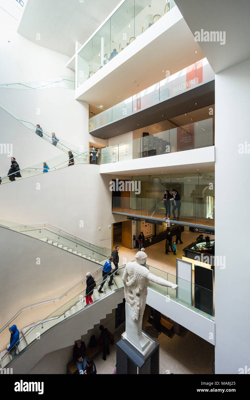 Oxford. England. The Ashmolean Museum, interior atrium and main staircase.  Statue of Apollo (foreground) in the Zvi and Ofra Meitar Family Fund Atriu Stock Photo