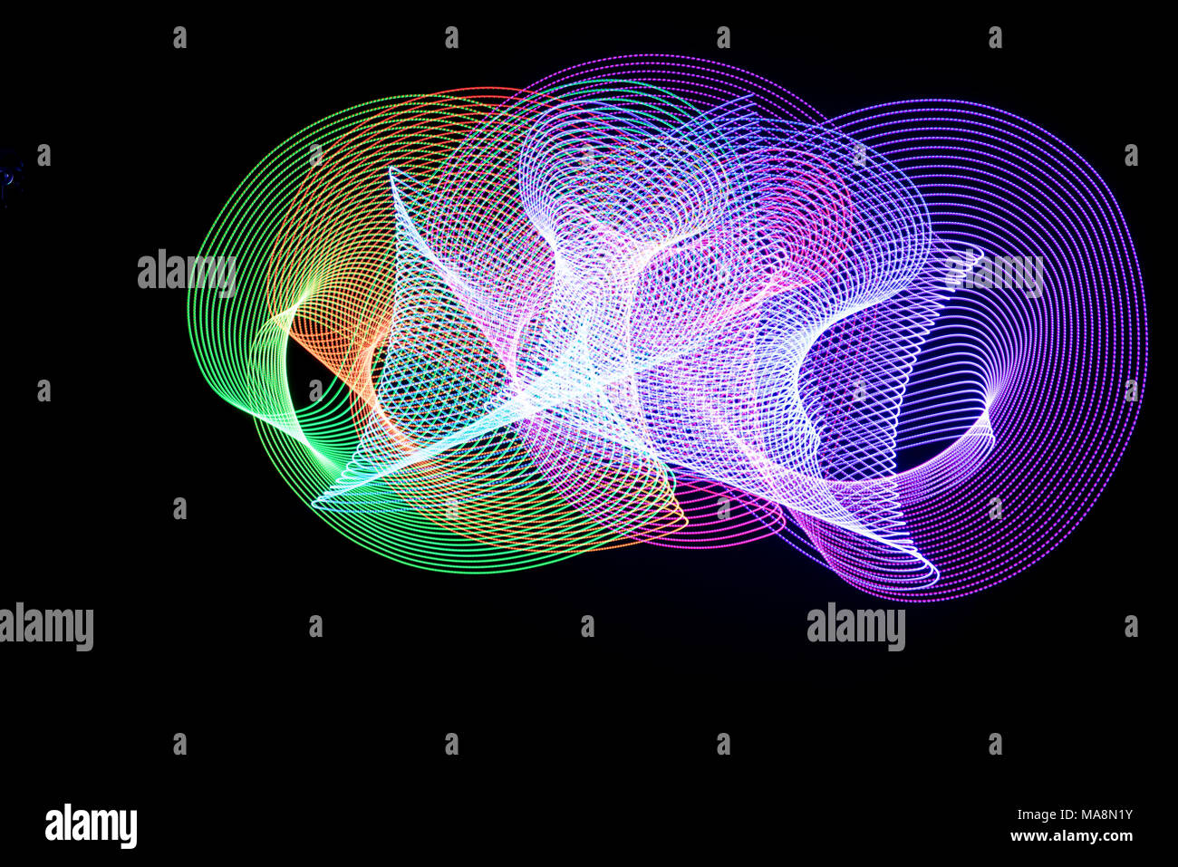 Multi color abstract light painting. LED lights on black background Stock Photo