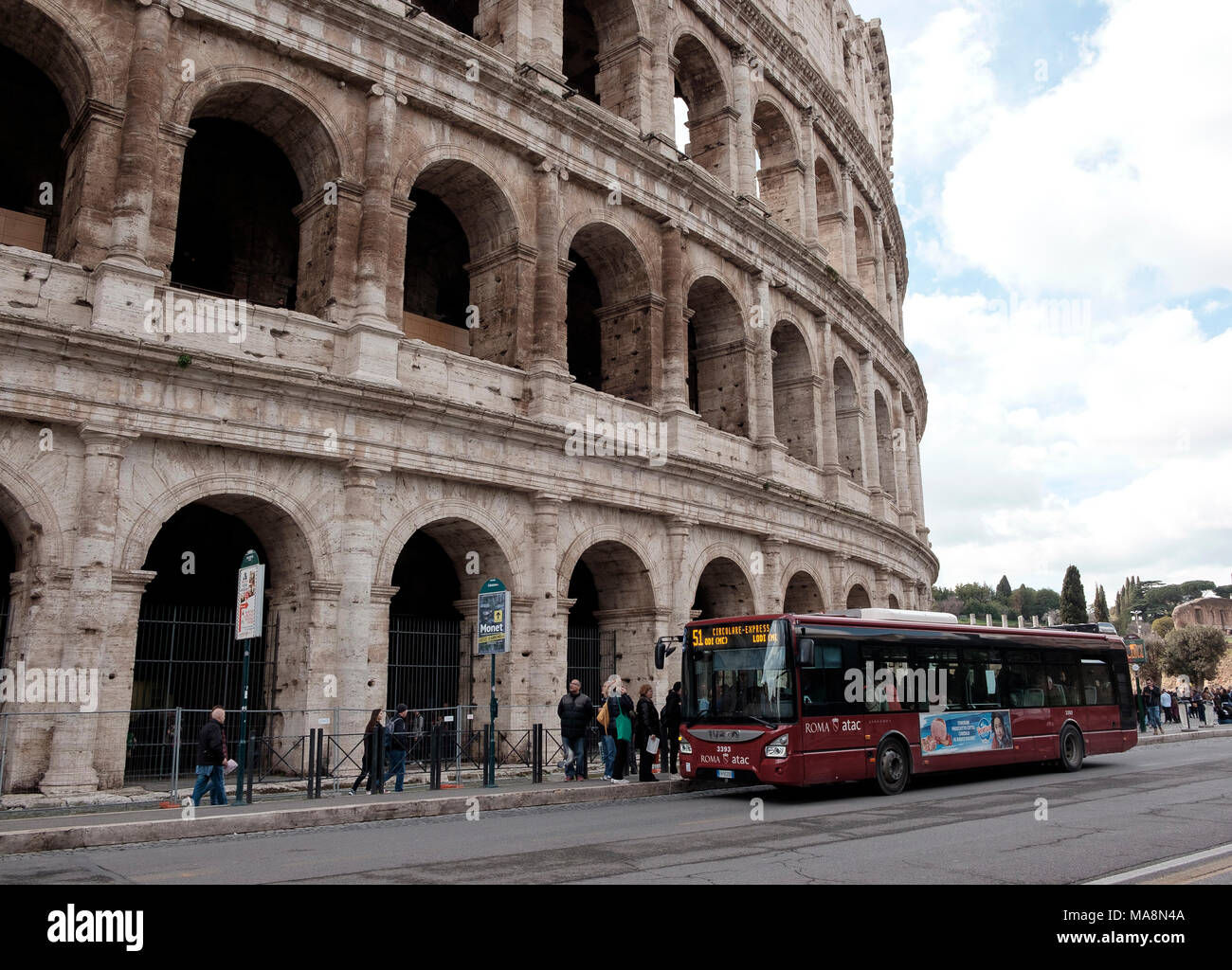 The 51 local bus service of Rome stopping outside The Colosseum Stock Photo