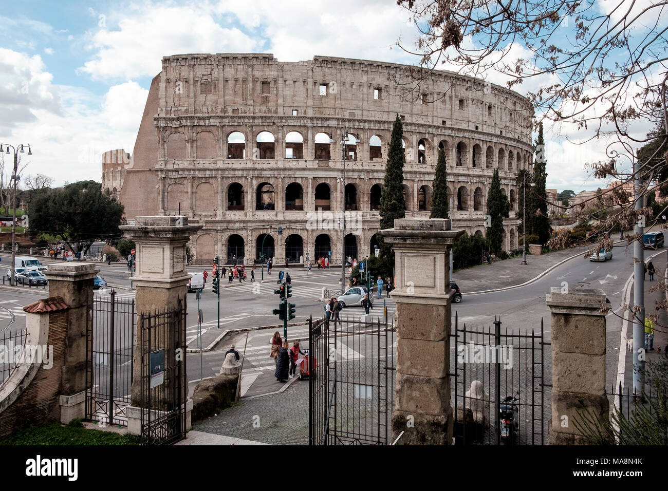 The Colosseum, Rome from the gates to The Oppian Hill Park. Stock Photo