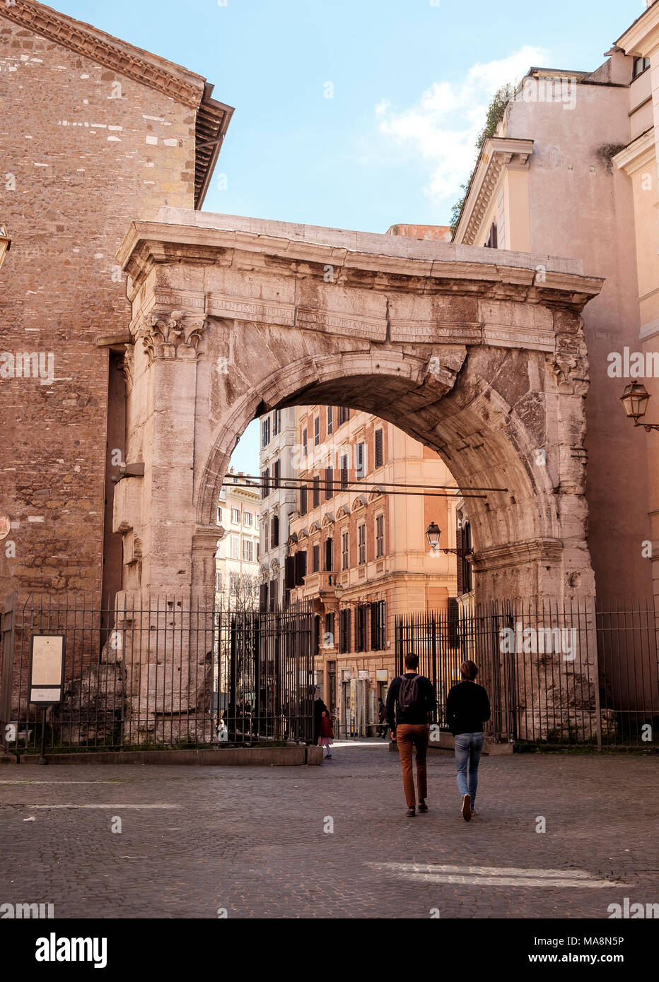 The Arco di Gallieno, Arch of Gallienus, Rome is crumbling but added strengthening holds it erect. Marking the start of the ancient Roman roads of  vi Stock Photo