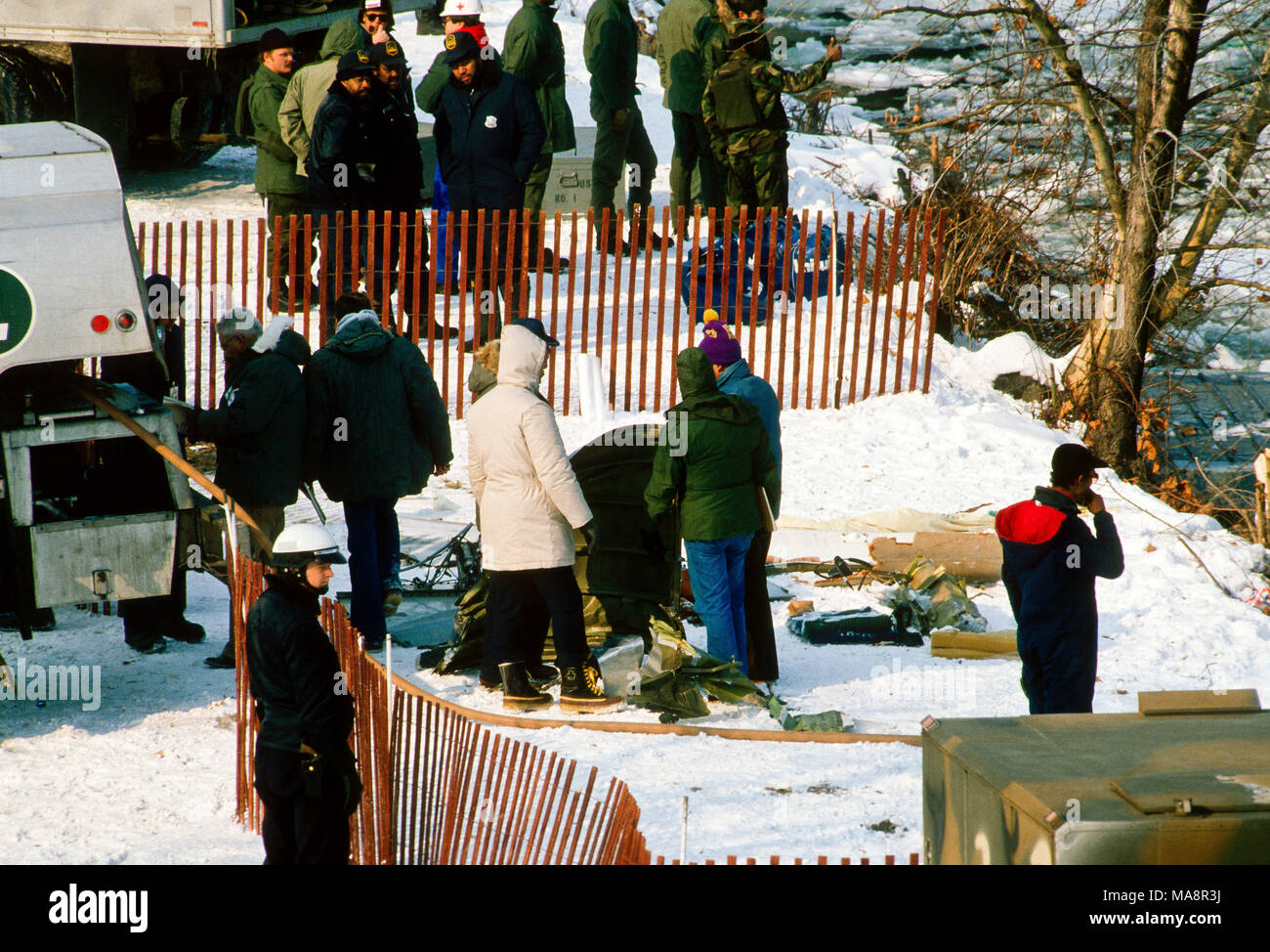 Washington, DC., USA, January 16, 1982 On January 13, 1982, Air Florida Flight 90 crashed into Washington, DC's 14th Street Bridge and fell into the Potomac River shortly after taking off. A total of 70 passengers, 4 crew and 4 motorists on the bridge were killed. The crash of the Boeing 737-200 was due to an anti-icing system being left off. Investigators from the NTSB examine parts  of the plane fuselage of the doomed Air Florida flight as it recovered and brought on shore by divers. Credit: Mark Reinstein/MediaPunch Stock Photo