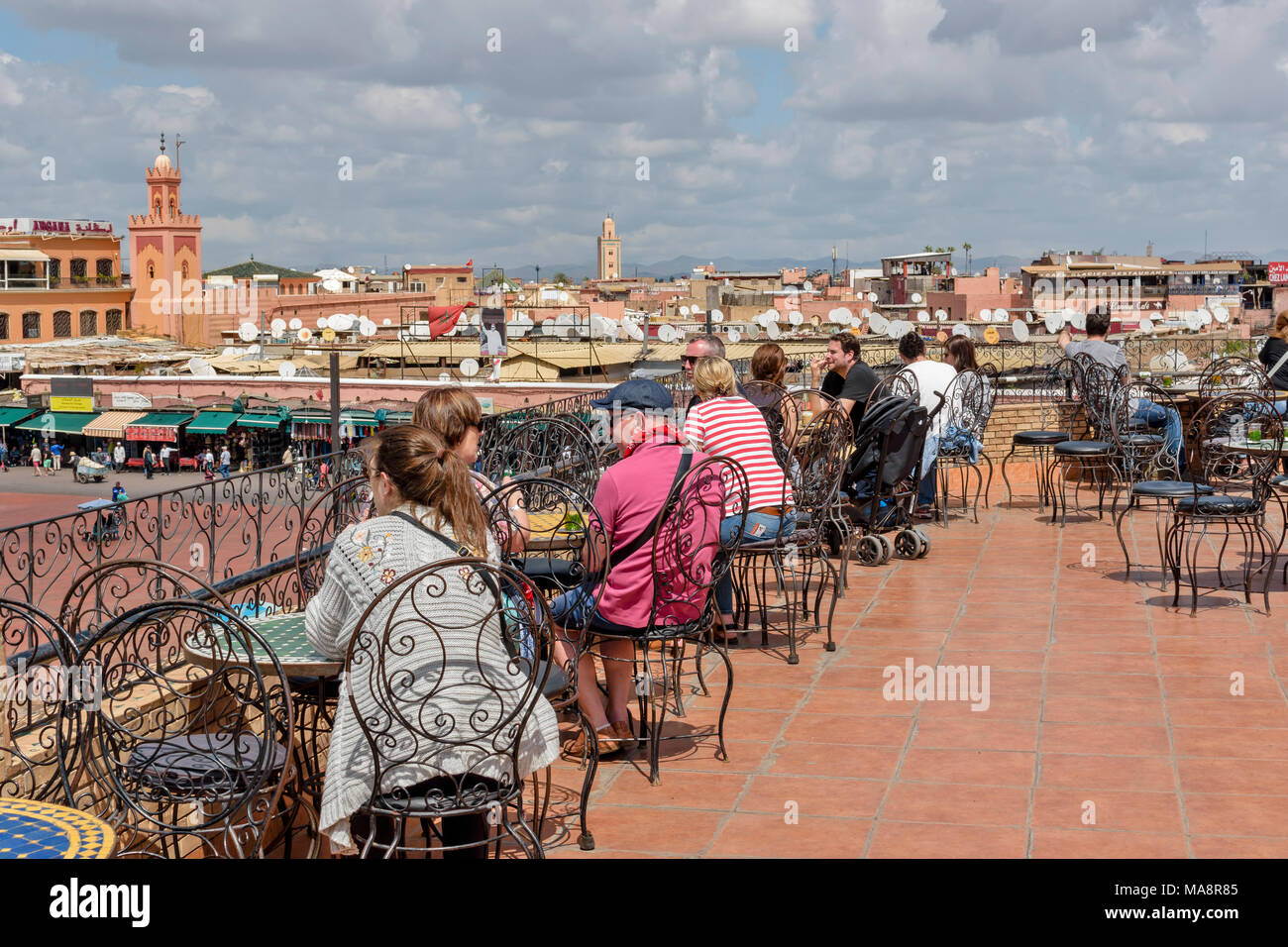 MOROCCO MARRAKECH PLACE JEMAA EL FNA TOURISTS VIEWING PLACE JEMAA EL FNA FROM OPEN AIR RESTAURANT Stock Photo