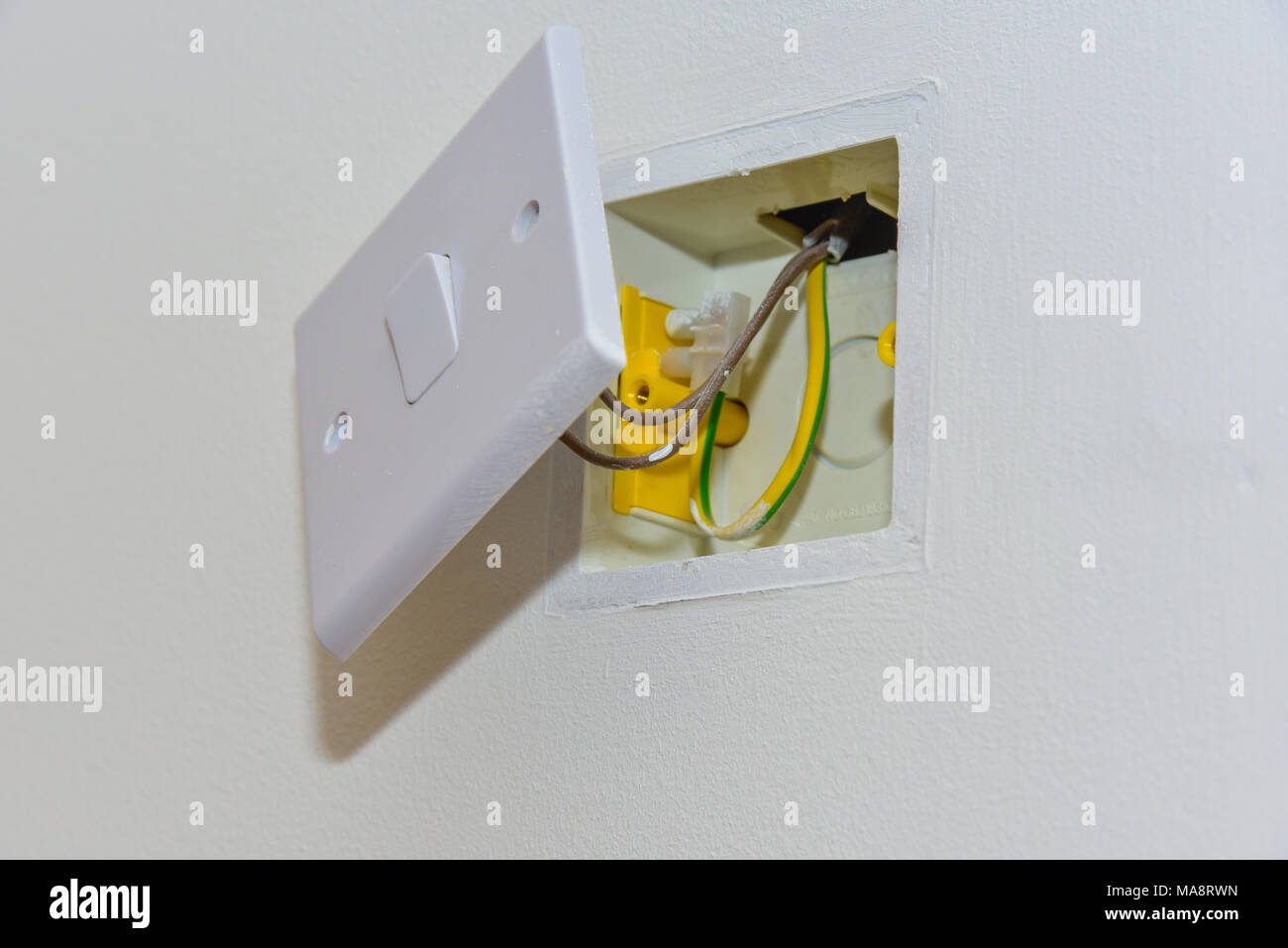 Wall power socket mounted on a plasterboard wall Stock Photo Alamy