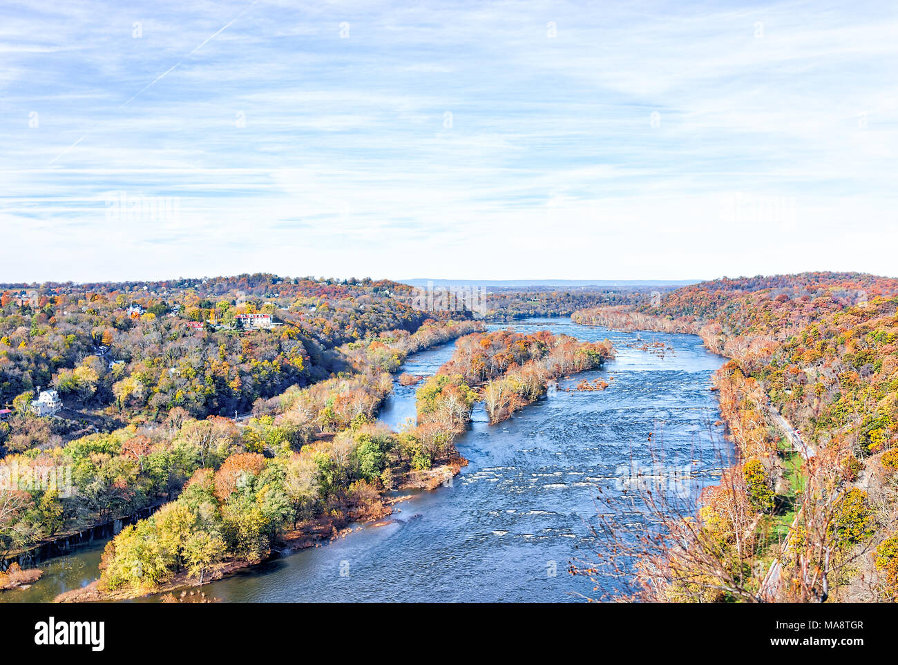 Harper's Ferry overlook with colorful orange yellow foliage fall autumn forest with small village town by Potomac river blue in West Virginia, WV Stock Photo