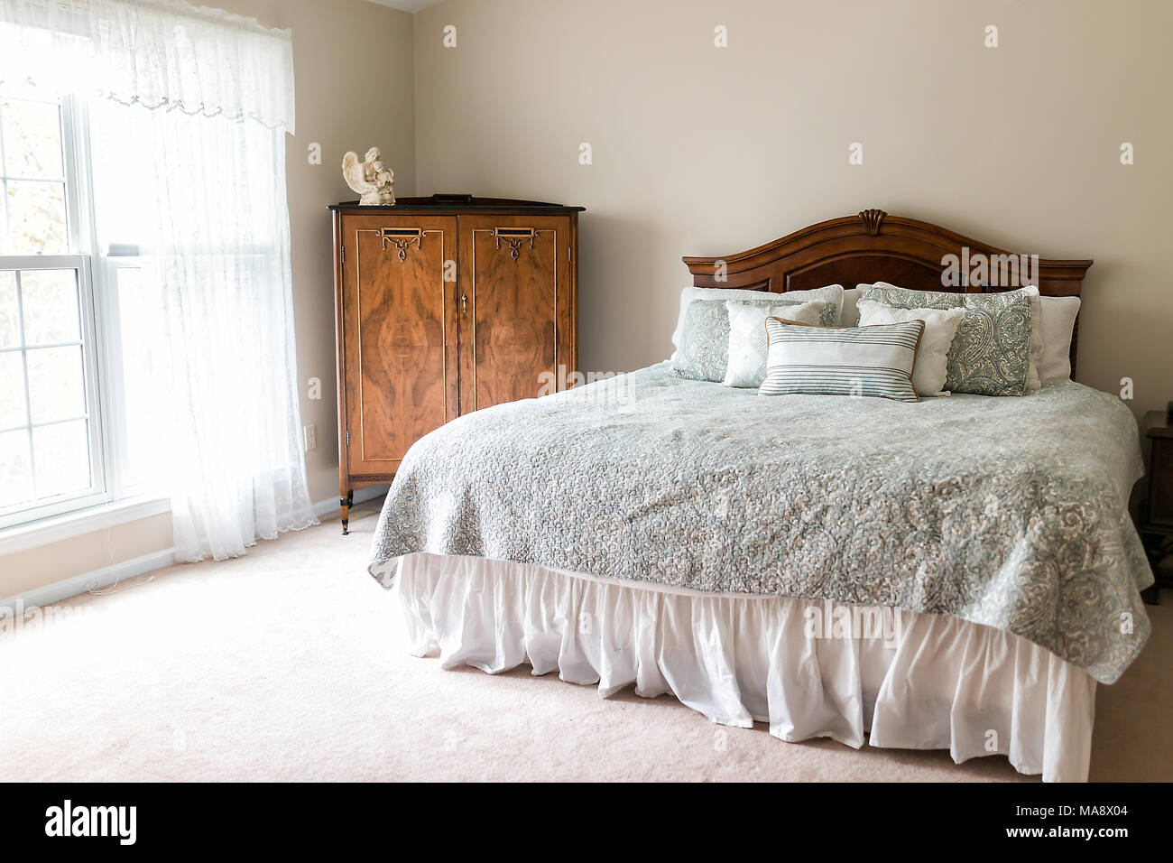 New bed comforter with headboard, decorative pillows, window, in