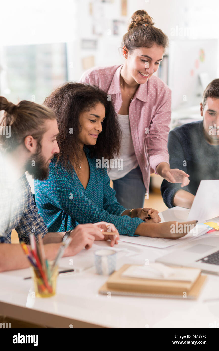 At office. A young multiethnic team at work. Stock Photo