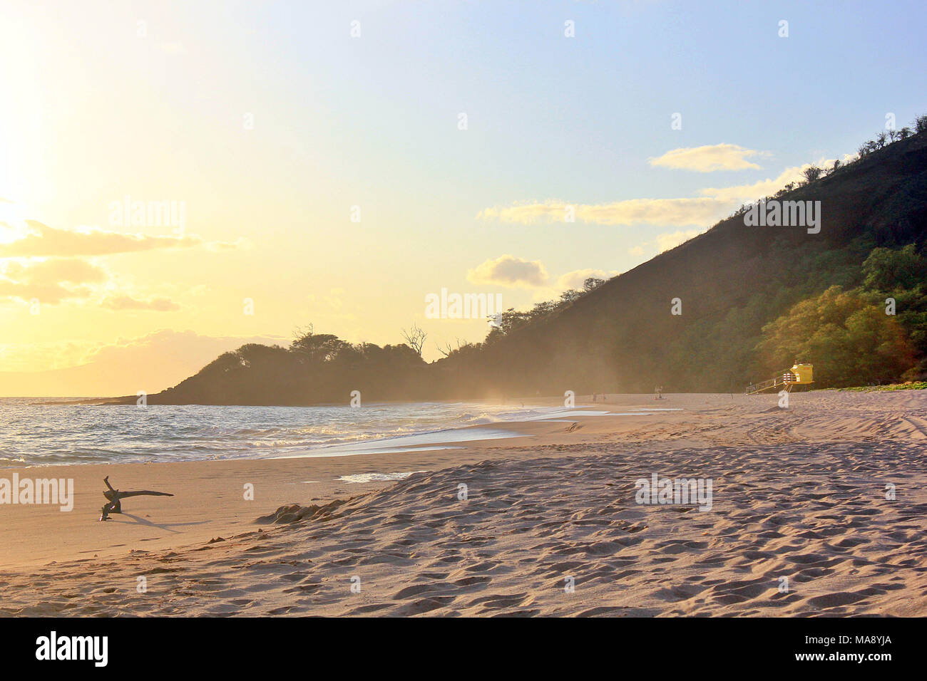 Sitting on a beach looking out on the ocean in the evening at Makena Beach on the Hawaiian Island of Maui. Stock Photo