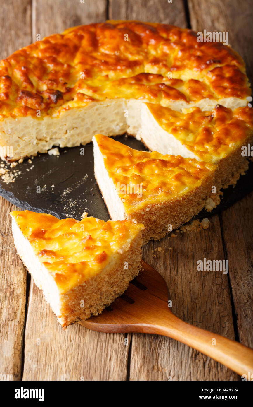 Delicious sliced rice pie with ricotta cheese closeup on the table