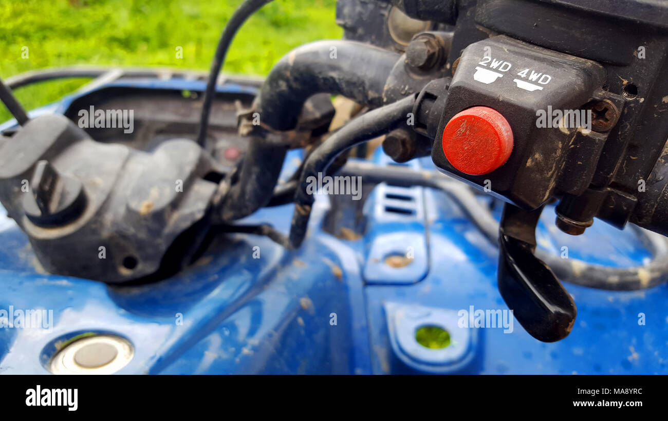 Button 4wd switch of a atv quad bike Stock Photo - Alamy