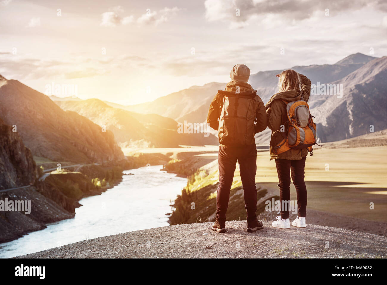 Couple backpackers travel mountains concept Stock Photo