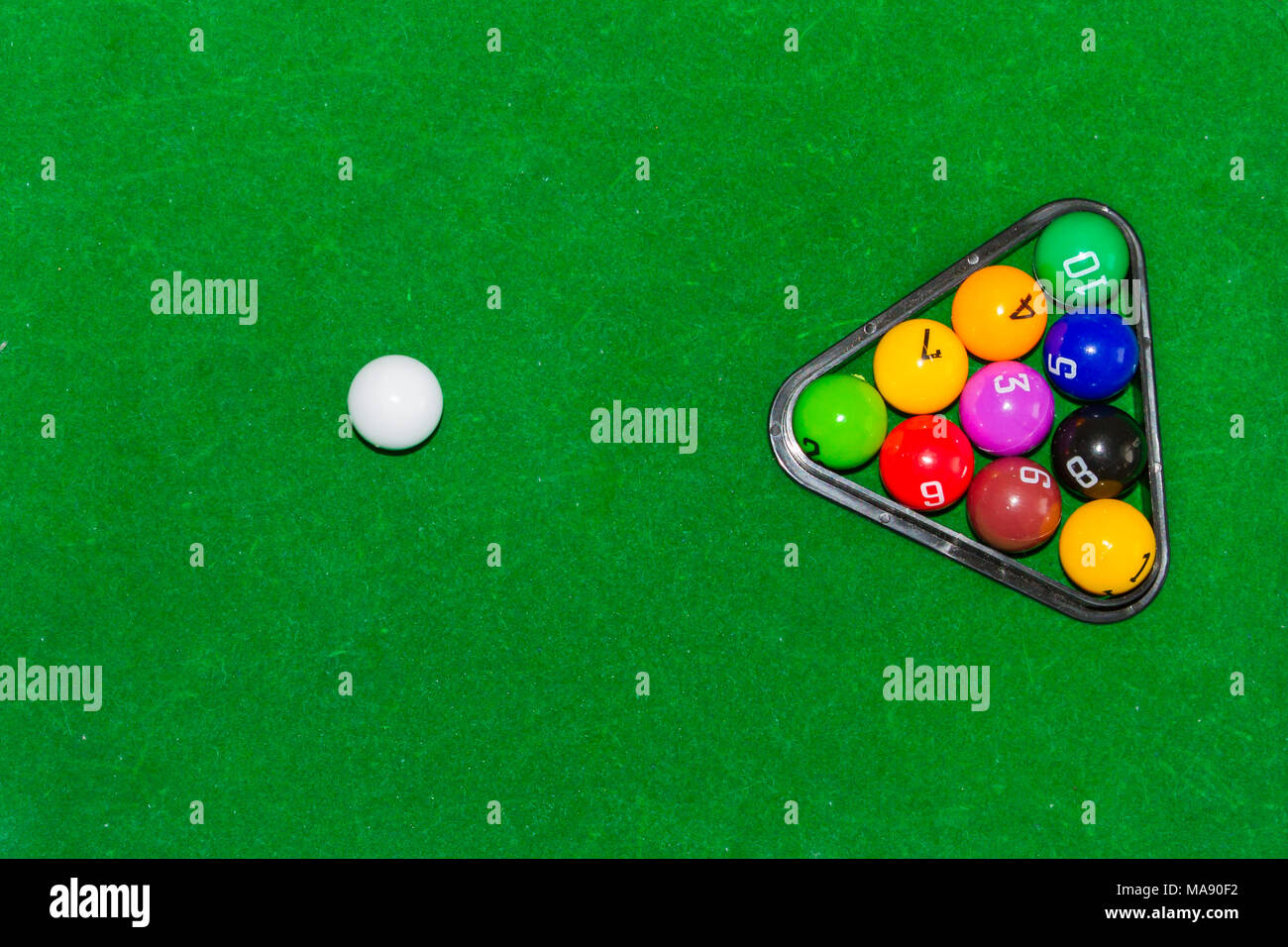 Children's pool table game with multicolored balls Stock Photo Alamy