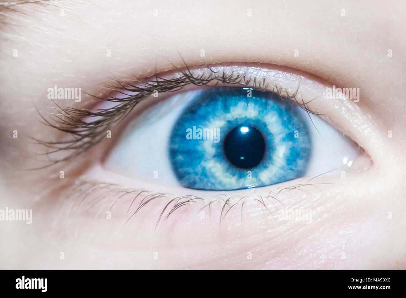Baby blue beautiful, brooding eyes of a boy Stock Photo - Alamy