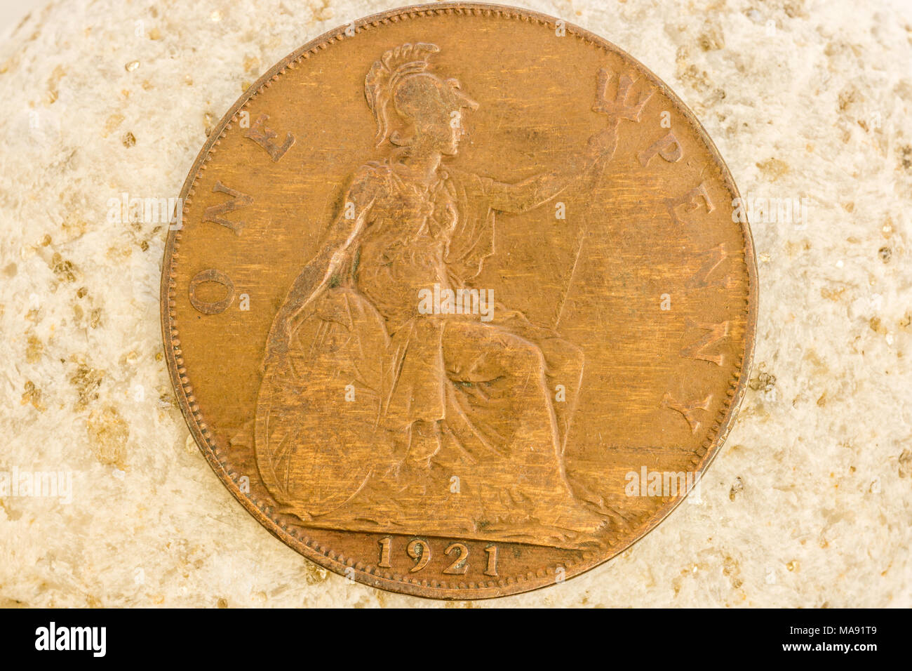 Close up view of aged vintage coin showing fine detail on coin engravings Stock Photo