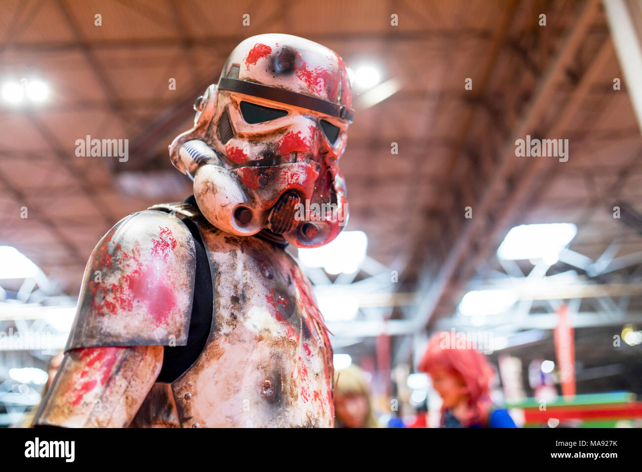 Birmingham, UK - March 17, 2018. A cosplayer dressed as a battered, bloodied and war torn Storm Trooper costume from Star Wars movies at a comic con i Stock Photo