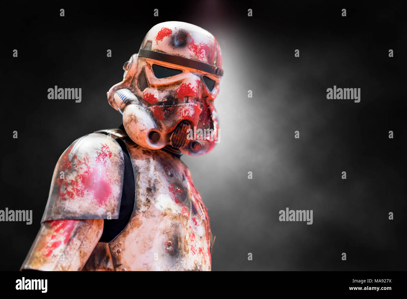Birmingham, UK - March 17, 2018. A cosplayer dressed as a battered, bloodied and war torn Storm Trooper costume from Star Wars movies at a comic con i Stock Photo