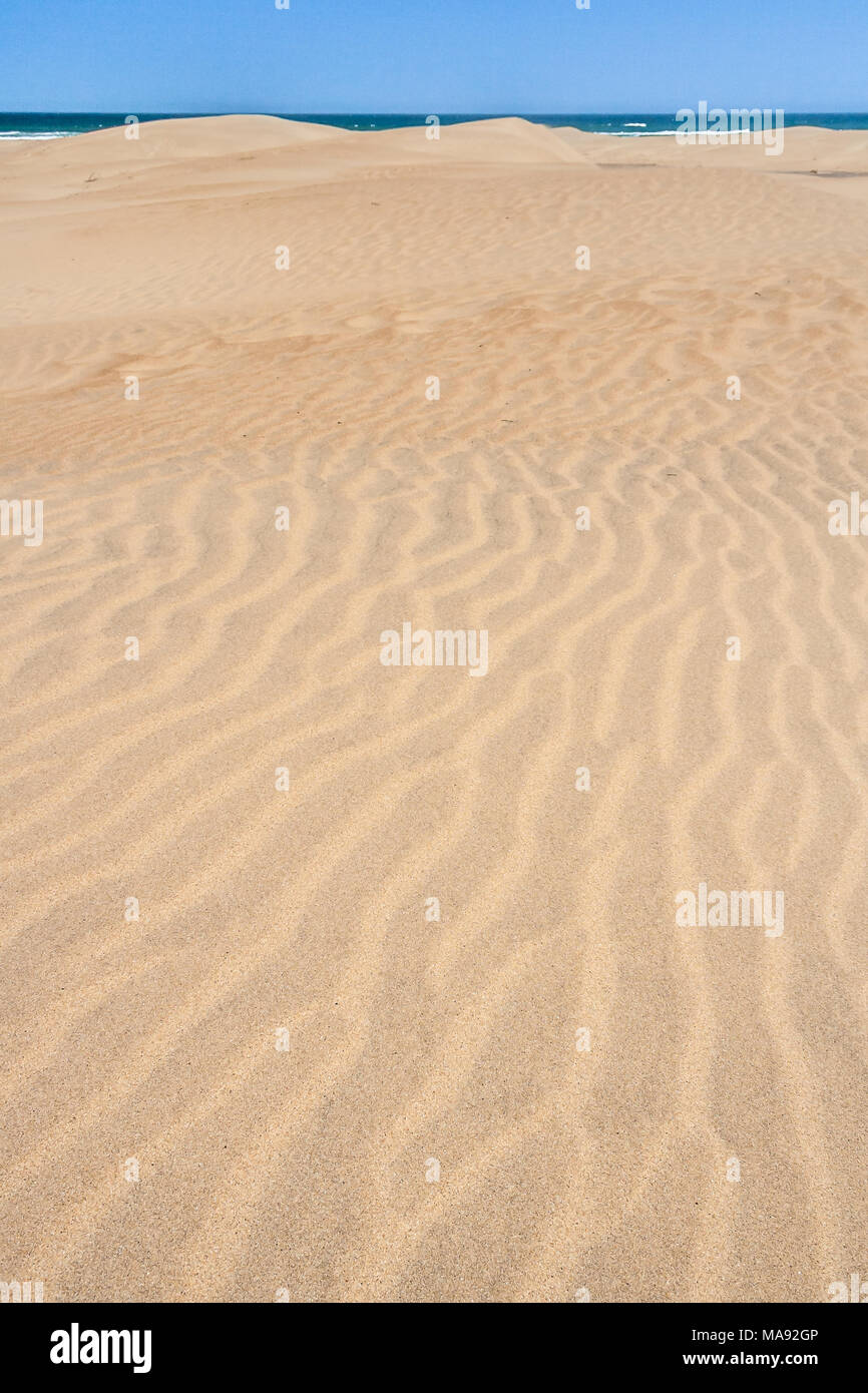 Sand dunes plunging into the Indian Ocean in Tolanaro, southern Madagascar Stock Photo