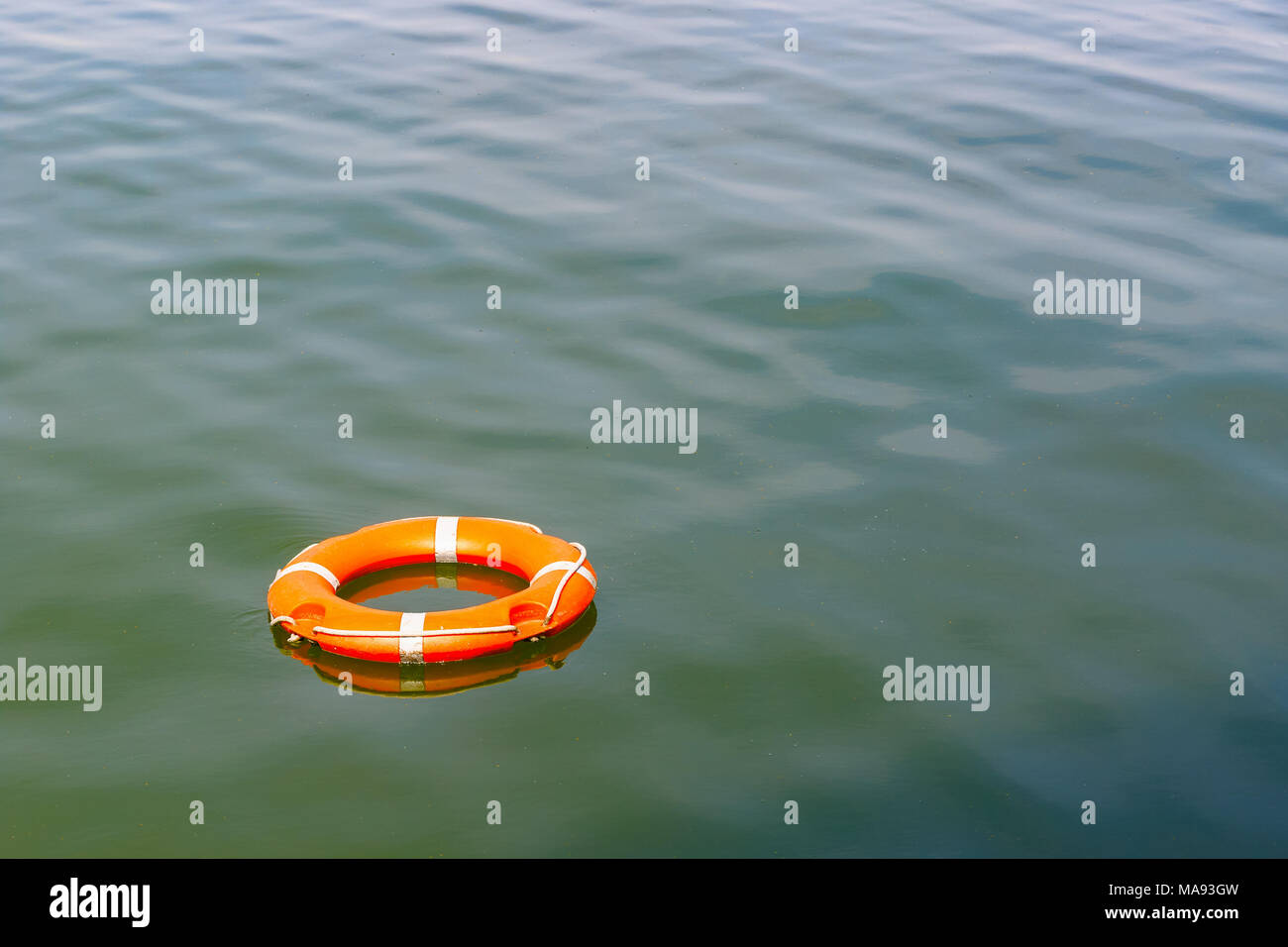 A lifebuoy floating on water for concept use Stock Photo