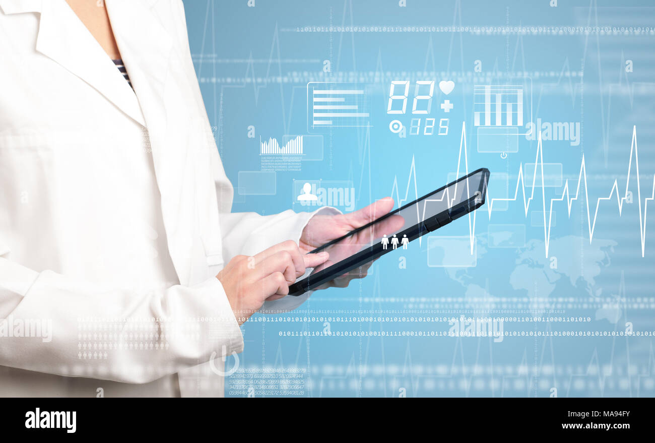 Female doctor holding tablet with blue background and heart related ...