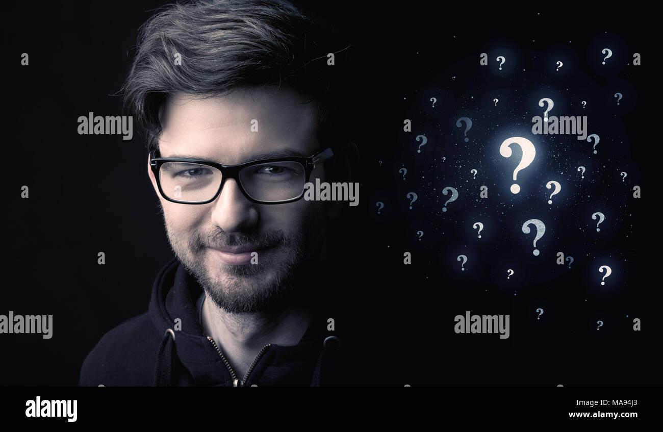 businessman with many question mark near him Stock Photo