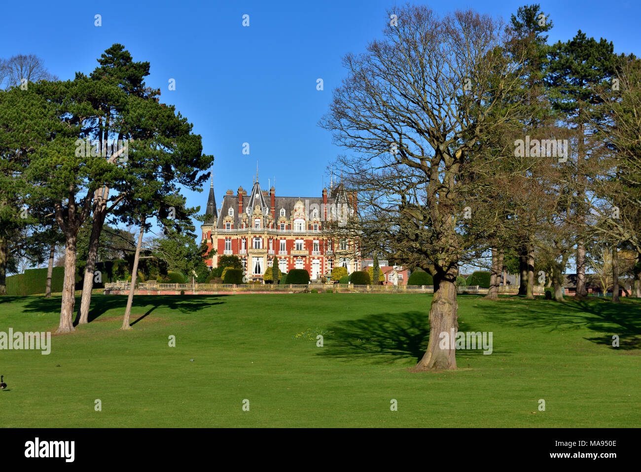 Landscaped gardens with 19th-century château housing Chateau Impney Hotel & Exhibition Centre, Droitwich Spa, UK Stock Photo