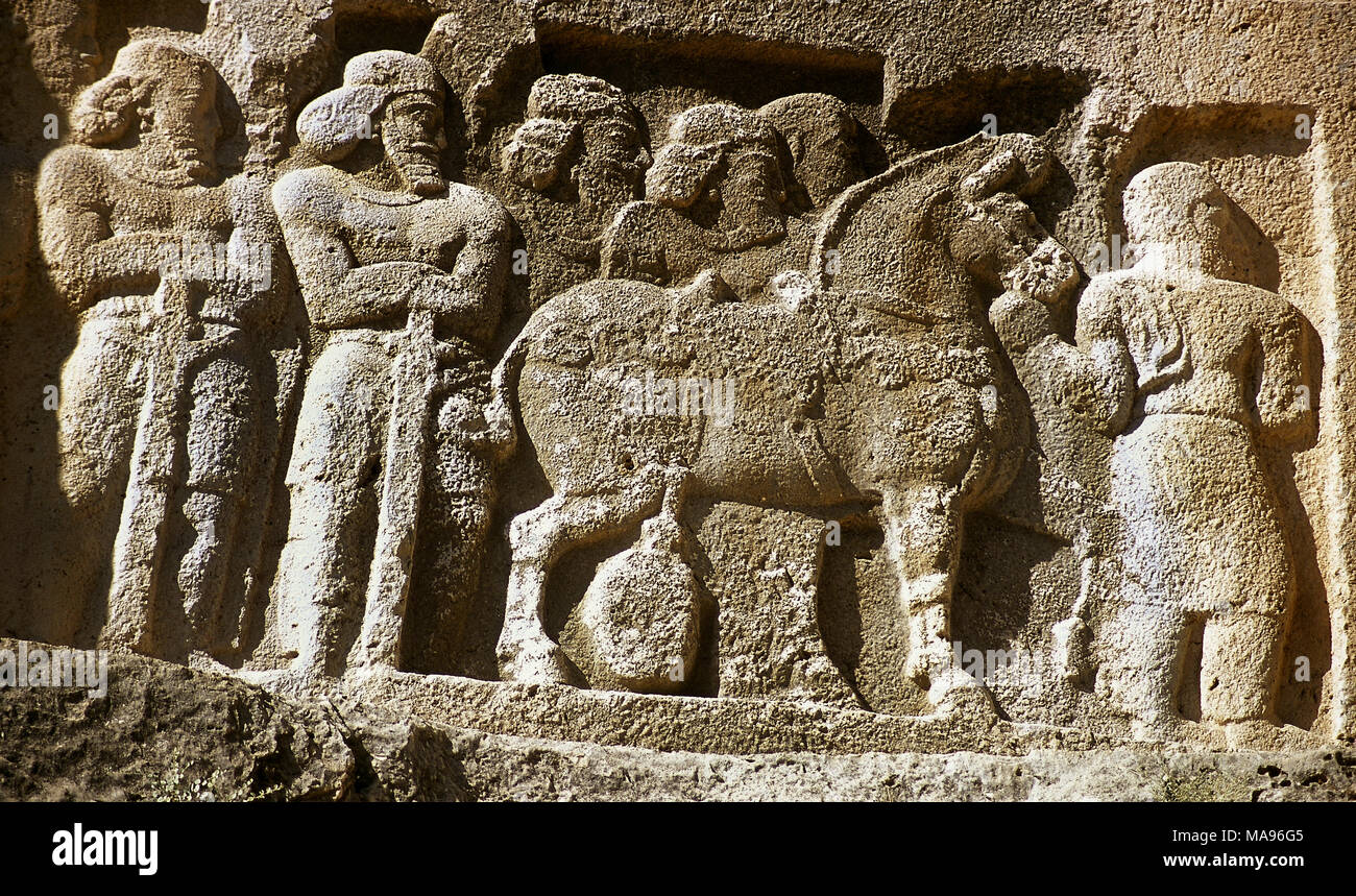 Sassanian rock relief, ca, 350 AD. Relief VI. The victory of King Shapur II (r. 309-379). Detail. Soldiers next to a horse. Bishapur, Fars Province, Iran. (Old Persia). Stock Photo