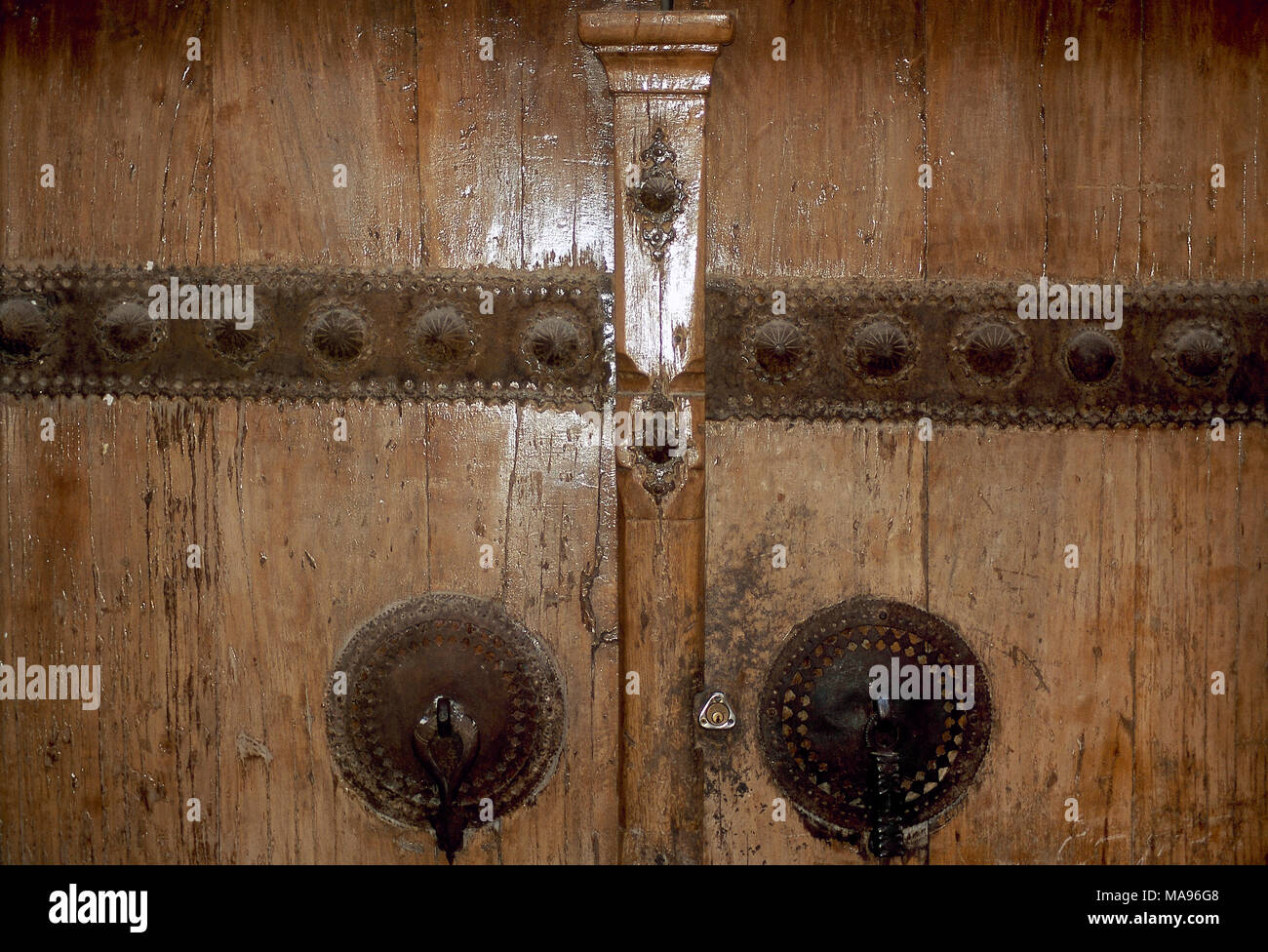 Wooden door with double caller, one for men and the other one for women. Islamic Republic of Iran. Stock Photo