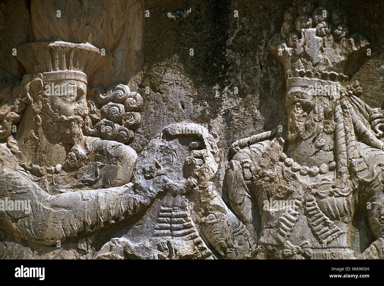 Sassanian rock relief. The Investiture of Narseh receiving the ring of kingship from a female figure (divinity Aredvi Sura or Queen Shapurdokhtak), c. 293-303. Naqsh-e Rustam, Fars Province,  Iran. (Ancient Persia). Stock Photo