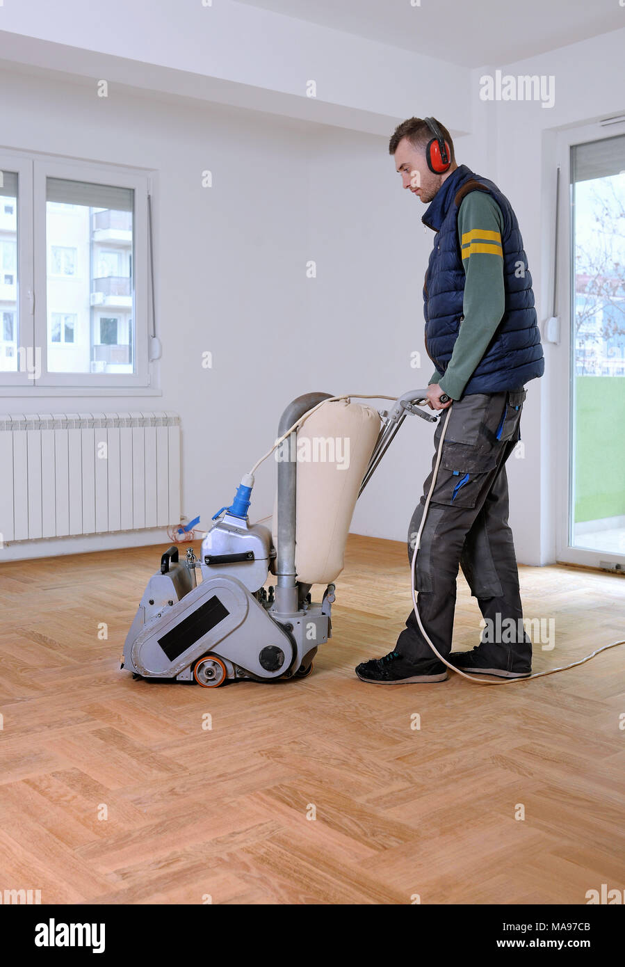 Sanding Hardwood Floor With The Grinding Machine Repair In The