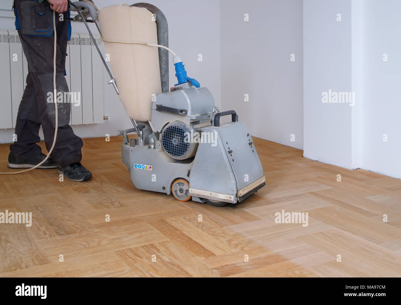 Sanding Hardwood Floor With The Grinding Machine Repair In The
