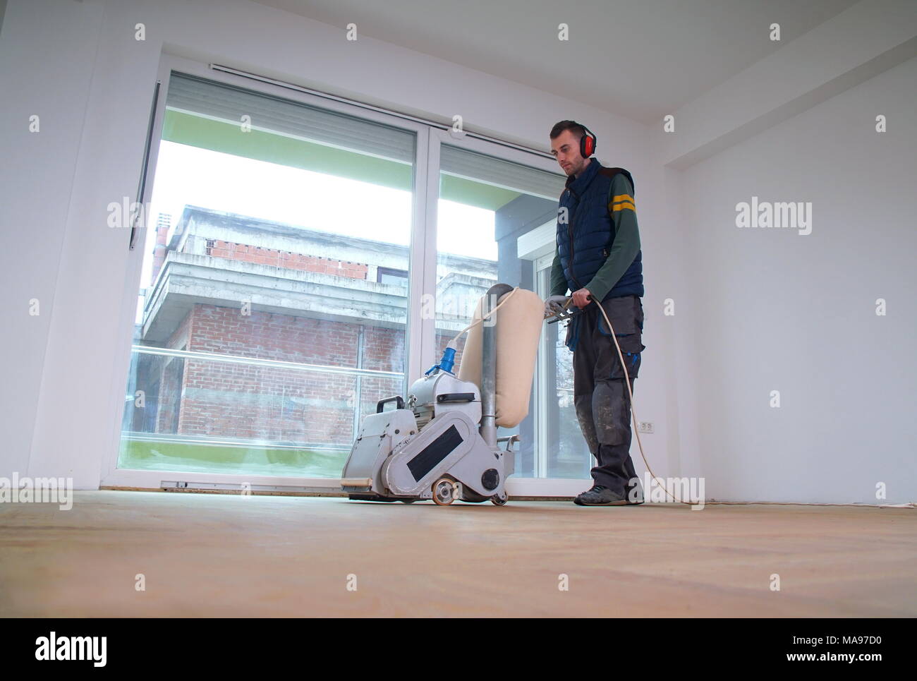 Sanding Hardwood Floor With The Grinding Machine Repair In The