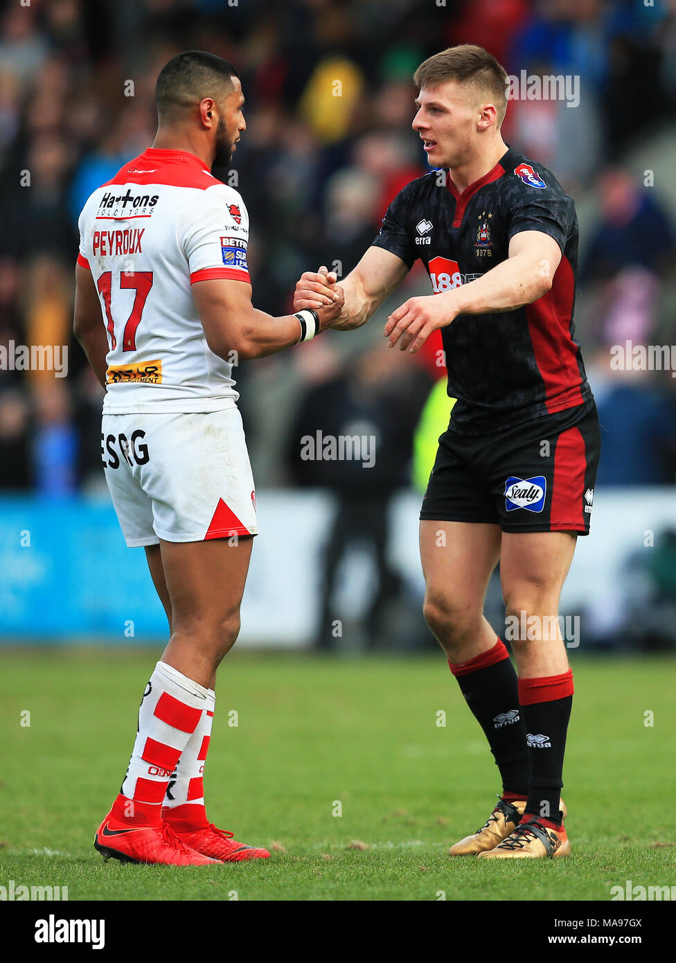 St Helens' Dominique Peyroux shakes hands with Wigan Warriors' Tom Davies  during the Super League match at the Totally Wicked Stadium, St Helens.  PRESS ASSOCIATION Photo. Picture date: Friday March 30, 2018.