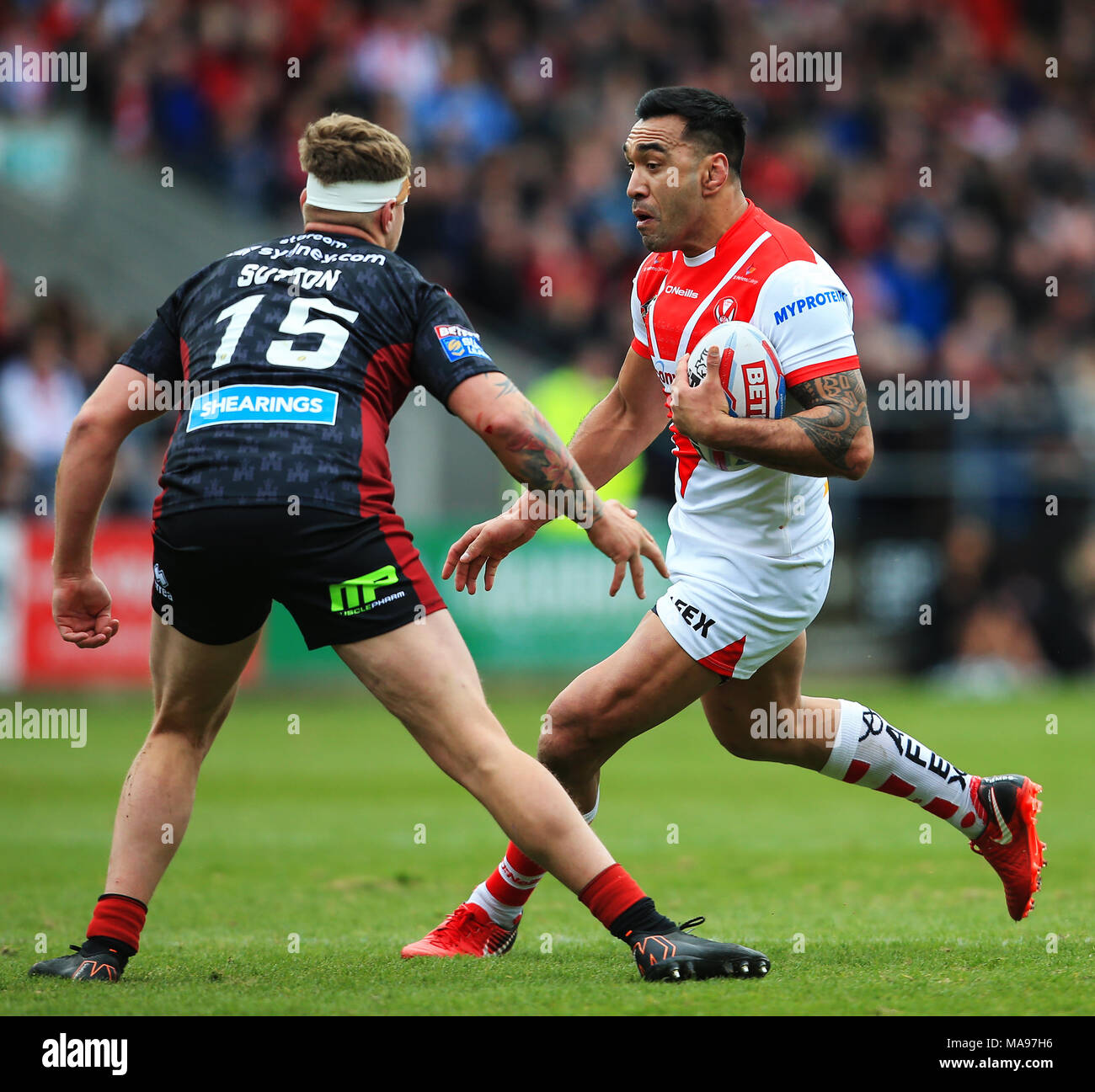 St Helens' Zeb Taia takes on Wigan Warriors' Ryan Sutton during the Super League match at the Totally Wicked Stadium, St Helens. PRESS ASSOCIATION Photo. Picture date: Friday March 30, 2018. See PA story RUGBYL St Helens. Photo credit should read: Matt McNulty/PA Wire. RESTRICTIONS: Editorial use only. No commercial use. No false commercial association. No video emulation. No manipulation of images. Stock Photo