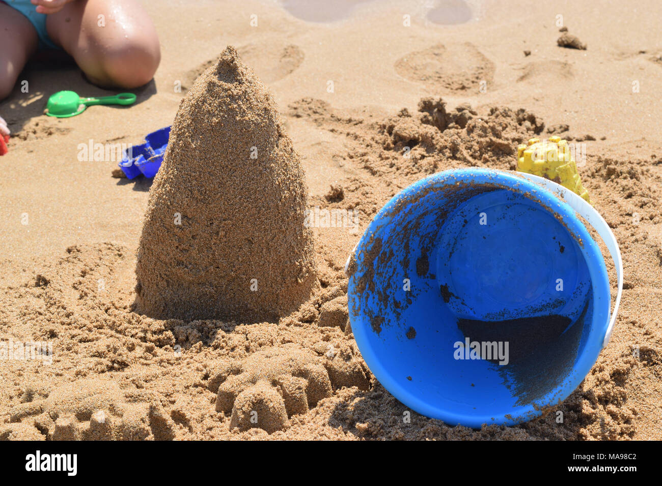 building a sand castle on the beach Stock Photo Alamy