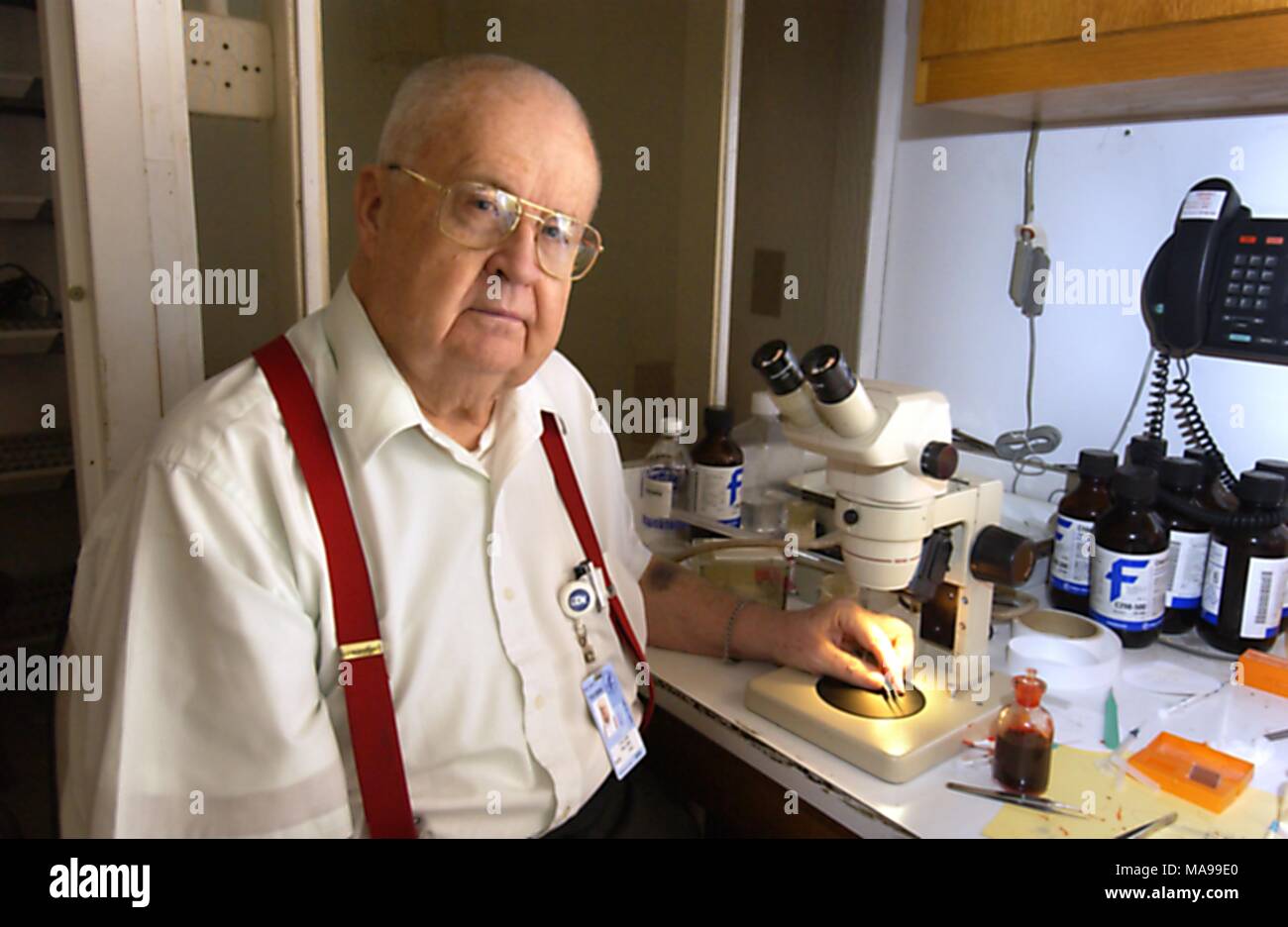 Dr William Bill Collins, a research biologist with the National Center for Infectious Diseases (NCID), Division of Parasitic Diseases (DPD), at his workplace, 2004. Image courtesy Centers for Disease Control (CDC) / Patrice Raithel and Mary Bartlett. () Stock Photo