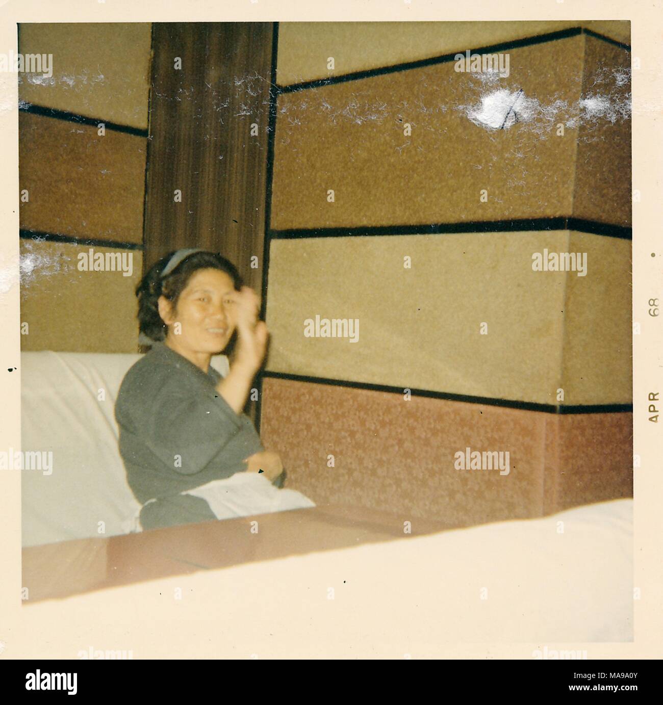 Color Photograph Of An Older Asian Woman With Short Hair A