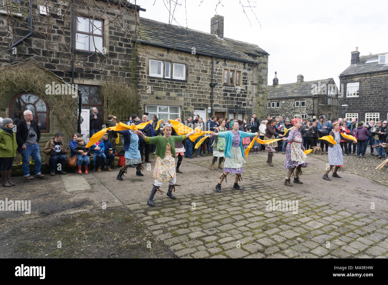 Heptonstall, UK. 30th March, 2018. Prior to the PACE EGG Play a  'Traditional ' Yorkshire dance of the Washerwomen ! A traditional Pace Egg play is performed in Heptonstall’s Weavers Square on Good Fridays, attracting hundreds of visitors to the village. Credit: Steve Morgan/Alamy Live News Stock Photo