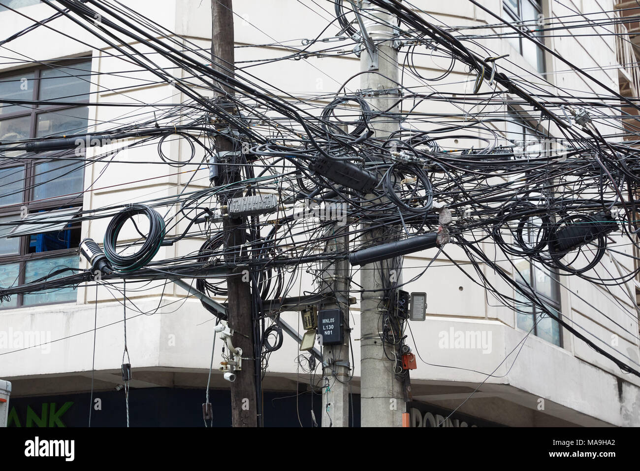 18 March 2018, Philippines, Manila Posts with power cables in the