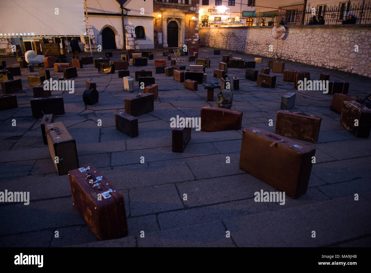 Krakow, Poland. 30th Mar, 2018. Bags seen as part of the decoration of a performance against the raise of Anti Semitism in the Jewish quarter in Krakow. According to the organizers, the performance reminds the public of the dramatic events of March 1968 in Poland, when the Communist regime expeled thousands of Jews. The main task of the performance is to show the effects of anti-Semitic politics of nowadays, the realization that politicians have woken up cruel demons in the nation again - lack of tolerance, xenophobia, fear of strangers. (Credit Image: © Omar Marques/SOPA Images via ZUMA Wir Stock Photo