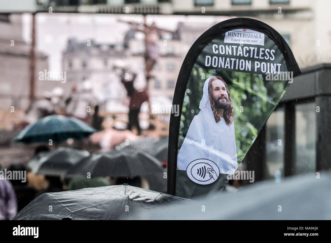 London, UK. 30th March, 2018. James Burke-Dunsmore as Jesus in the annual open-air performance of 'The Passion of Jesus' by the Wintershall Players on a rainy Easter Good Friday bank holiday in Trafalgar Square. Credit: Guy Corbishley/Alamy Live News Stock Photo