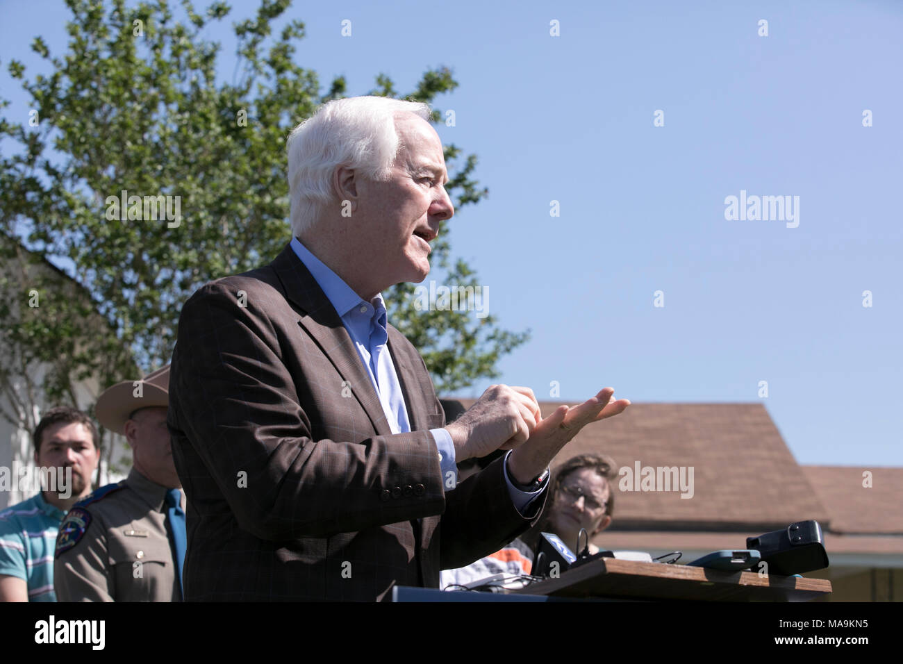 U.S. Sen. John Cornyn talks to the press about his Fix NICS Act, signed into law on March 23rd, in front of 1st Baptist Church of Sutherland Springs, TX, scene of a mass shooting in November 2017.  The bill strengthens criminal background checks intended to stop convicted felons and domestic abusers from purchasing firearms. Stock Photo