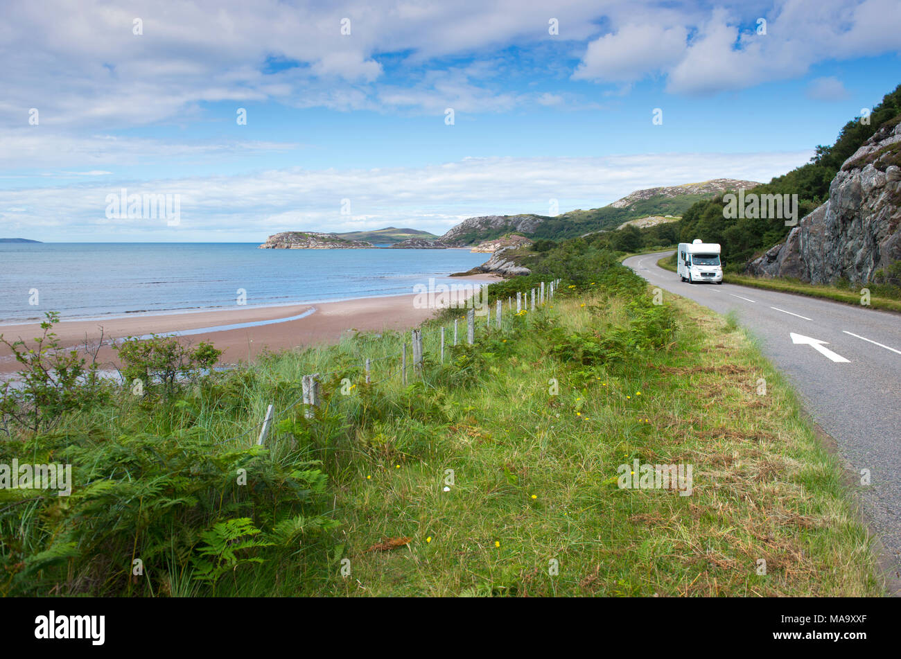 Camper van driving along the North Coast 500 scenic route in Wester Ross, Scotland Stock Photo