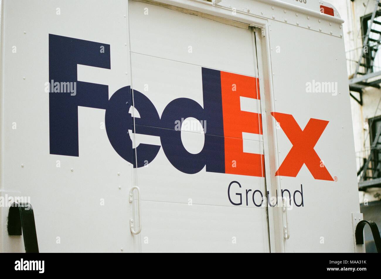 Close-up of logo on the back of a Federal Express (FedEx) Ground delivery truck in Manhattan, New York City, New York, September 15, 2017. () Stock Photo