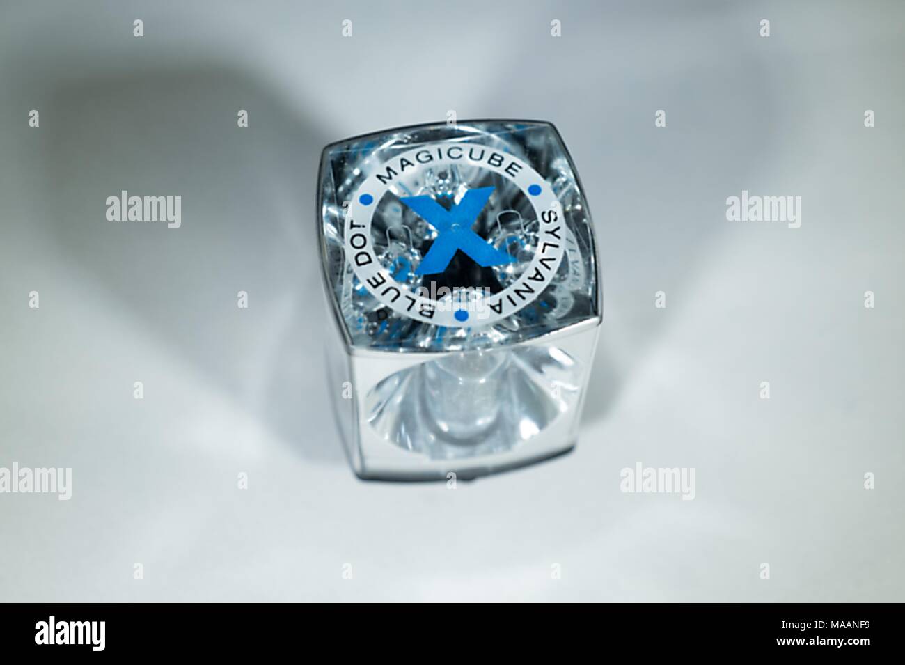 Close-up of a Sylvania Blue Dot Magicube, an early four-sided flash cube used with 1970s era Kodak Instamatic Cameras, February 5, 2018. Each cube allowed for four flashes, and rotated between exposures before being discarded. () Stock Photo