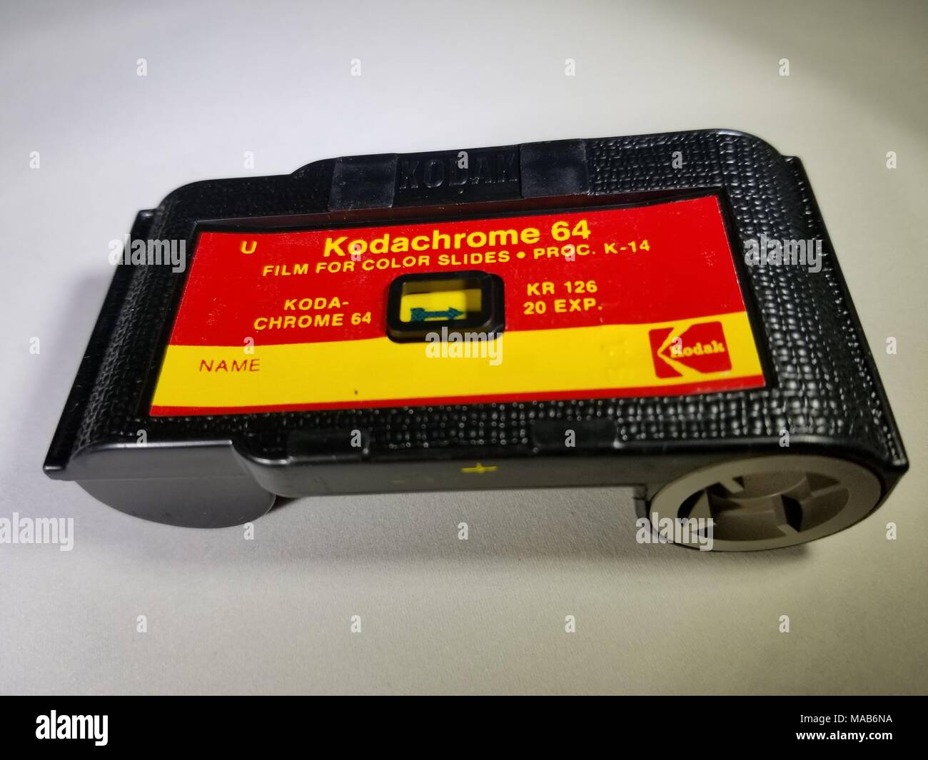 Close-up of Kodak 126 film cartridge containing Kodachrome 64 film, a classic color reversal slide film, used in 1960s and 1970s era Instamatic cameras, February 22, 2018. () Stock Photo
