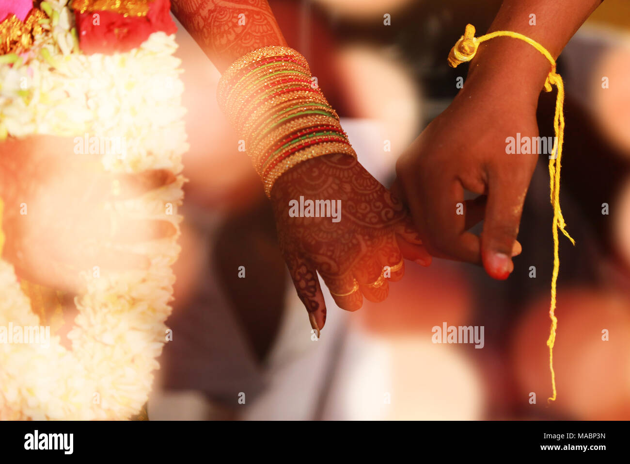 Indian Bride And Groom Holding Hands After The Wedding Stock Photo