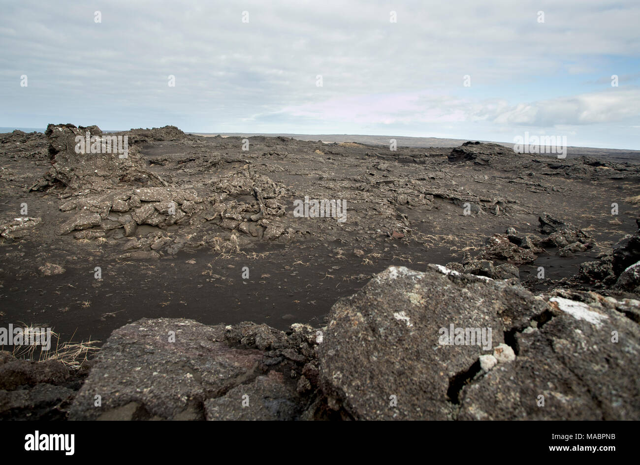 Iceland Landscape volcano lava field near to small town Stock Photo - Alamy