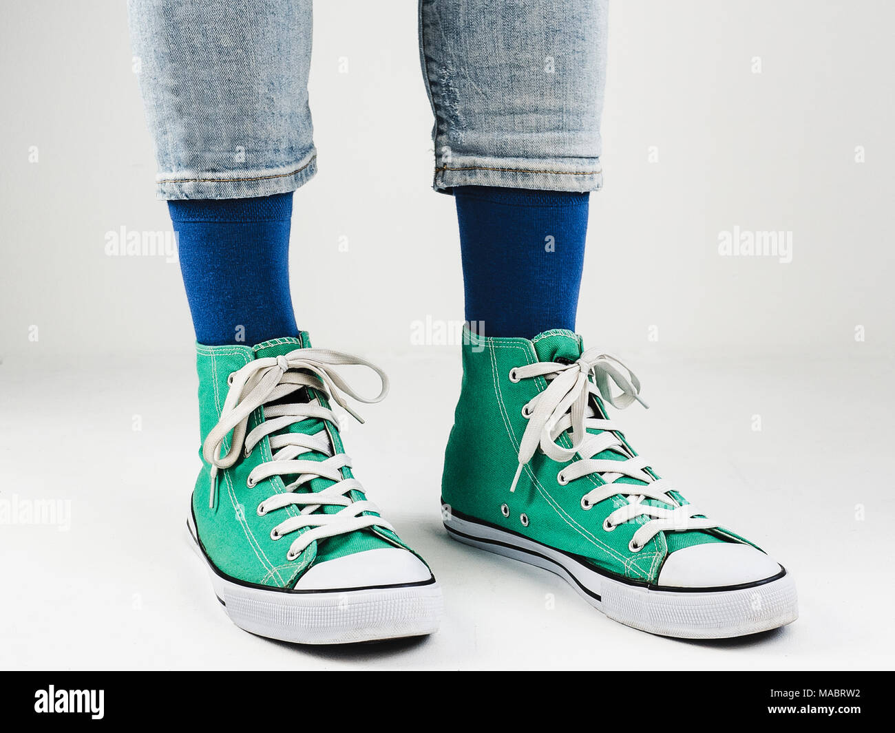 Stylish sneakers and funny, happy socks Stock Photo - Alamy